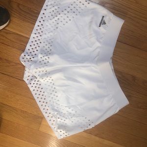 White eyelet edged tennis Adidas Stella McCartney shorts.